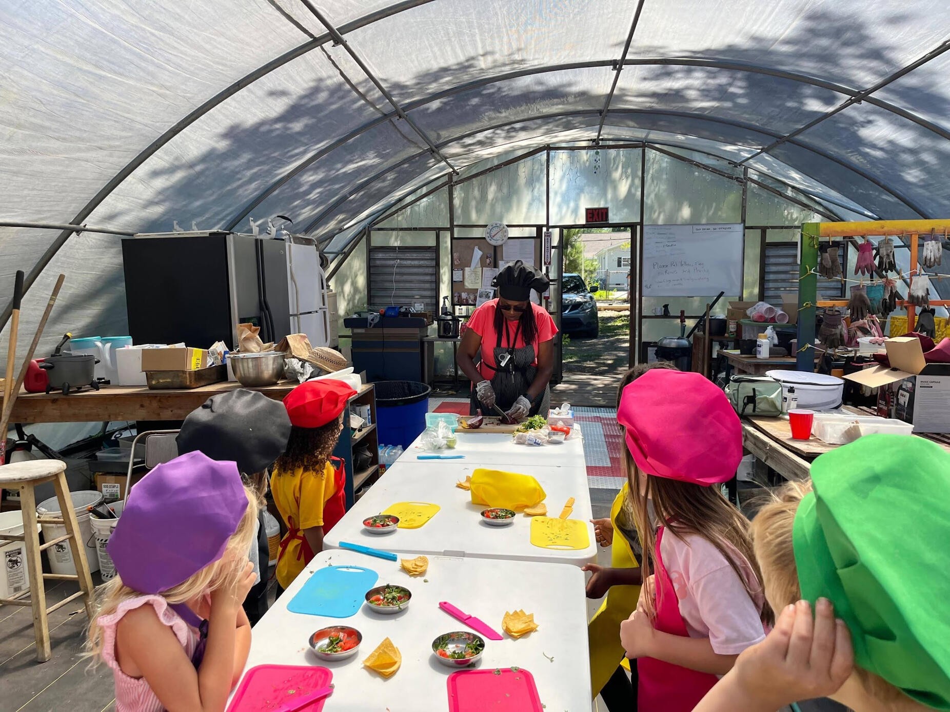 Chef Bev hosting kindergarten students from Peace Rose Montessori for a cooking class